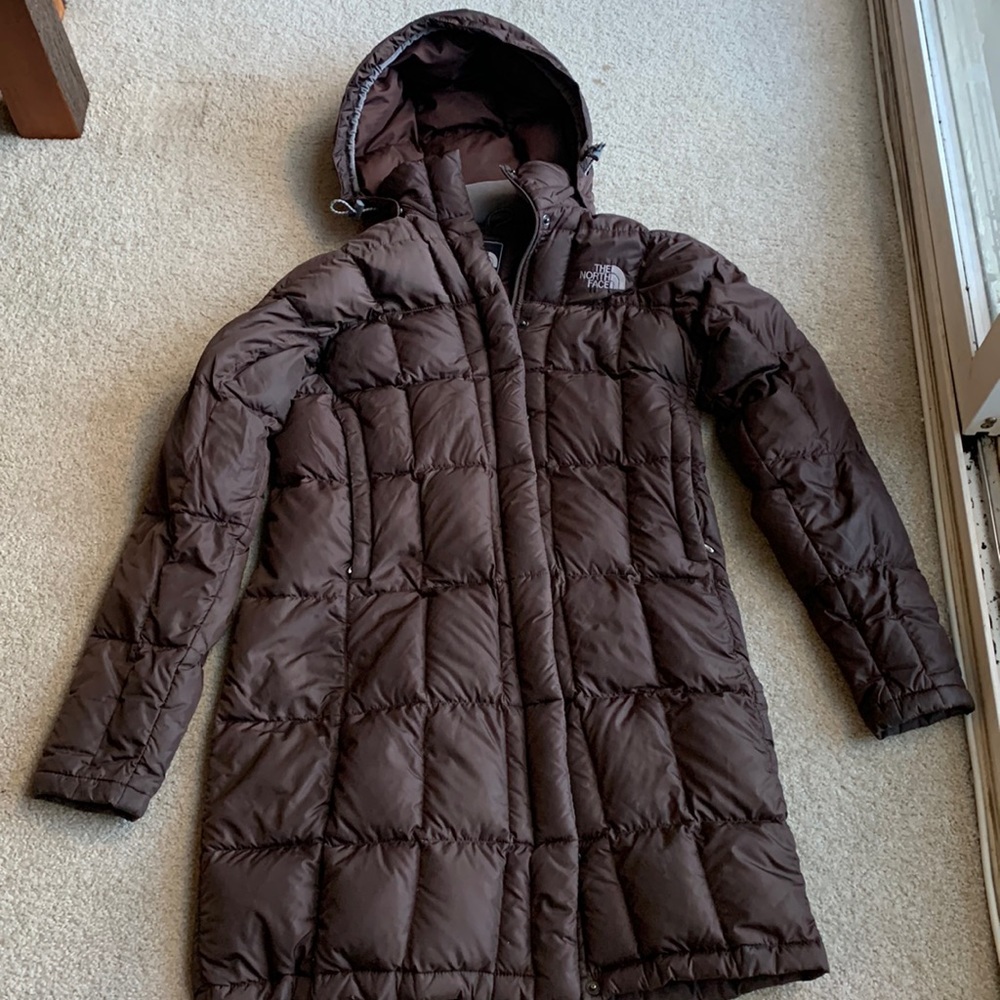 North Face brown puffer coat in size small.